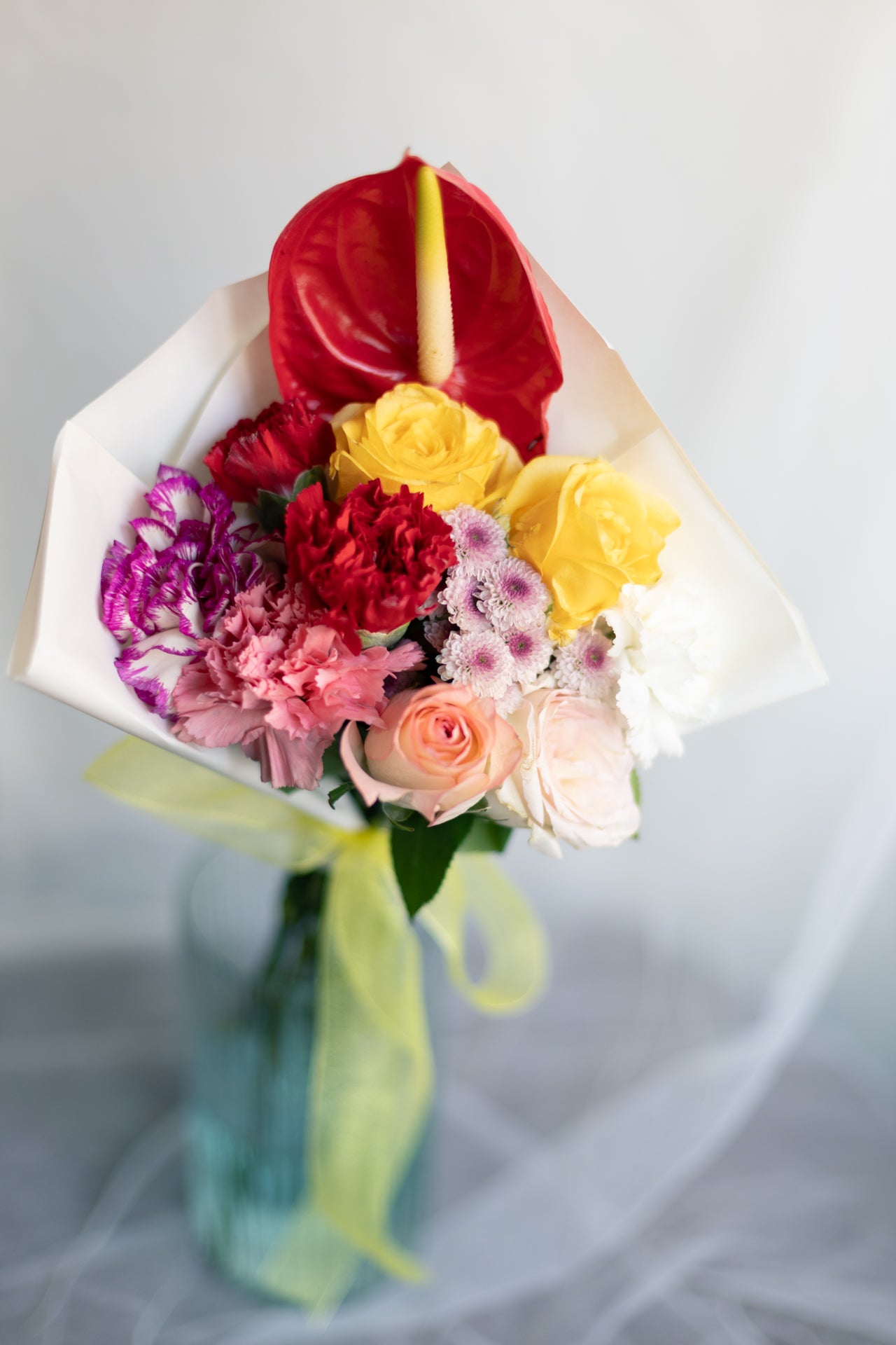 Bold Heart – Roses, Carnations & Anthurium Bunch
