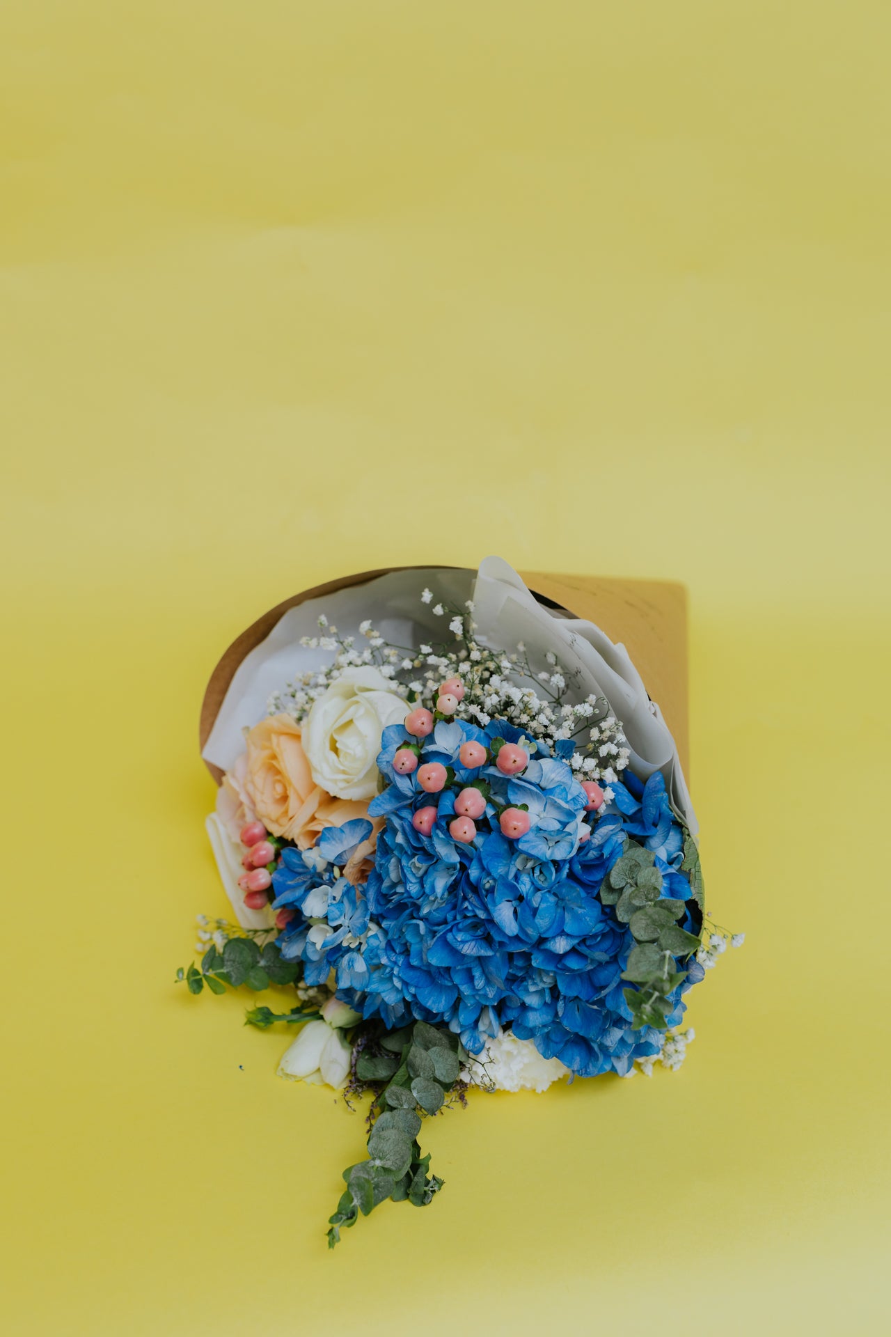 Whispers of Bliss: Blue Hydrangeas and Rosy Tones