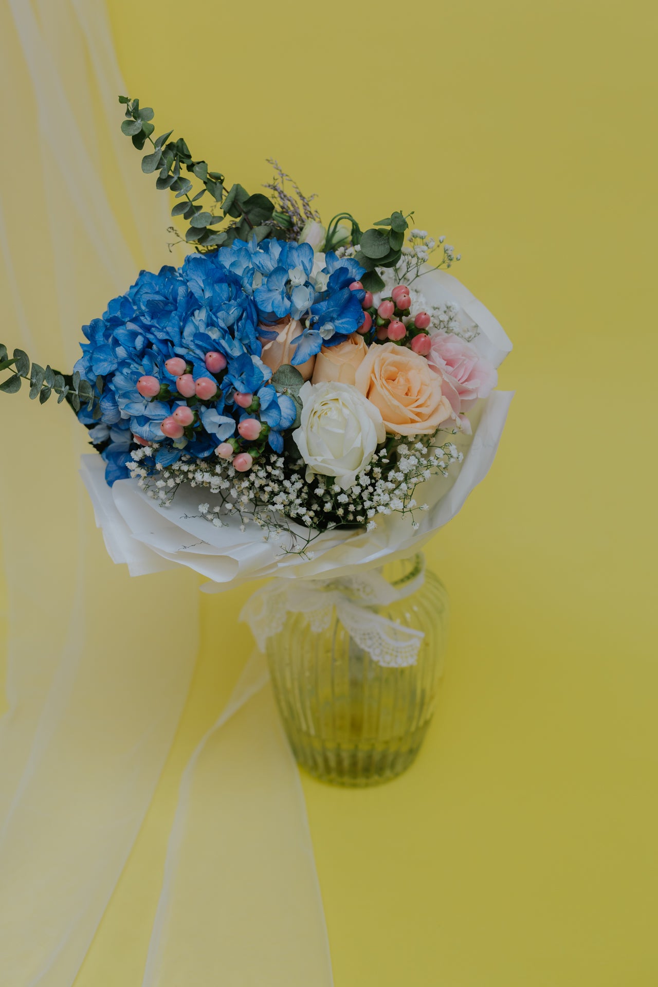Whispers of Bliss: Blue Hydrangeas and Rosy Tones