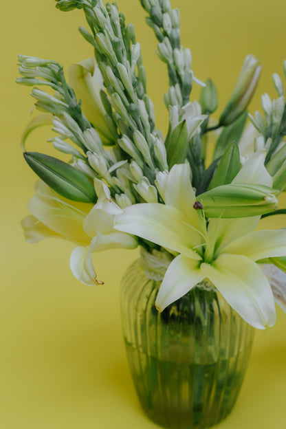 Ivory Fushion in Vase: Lilies and Rajnigandha
