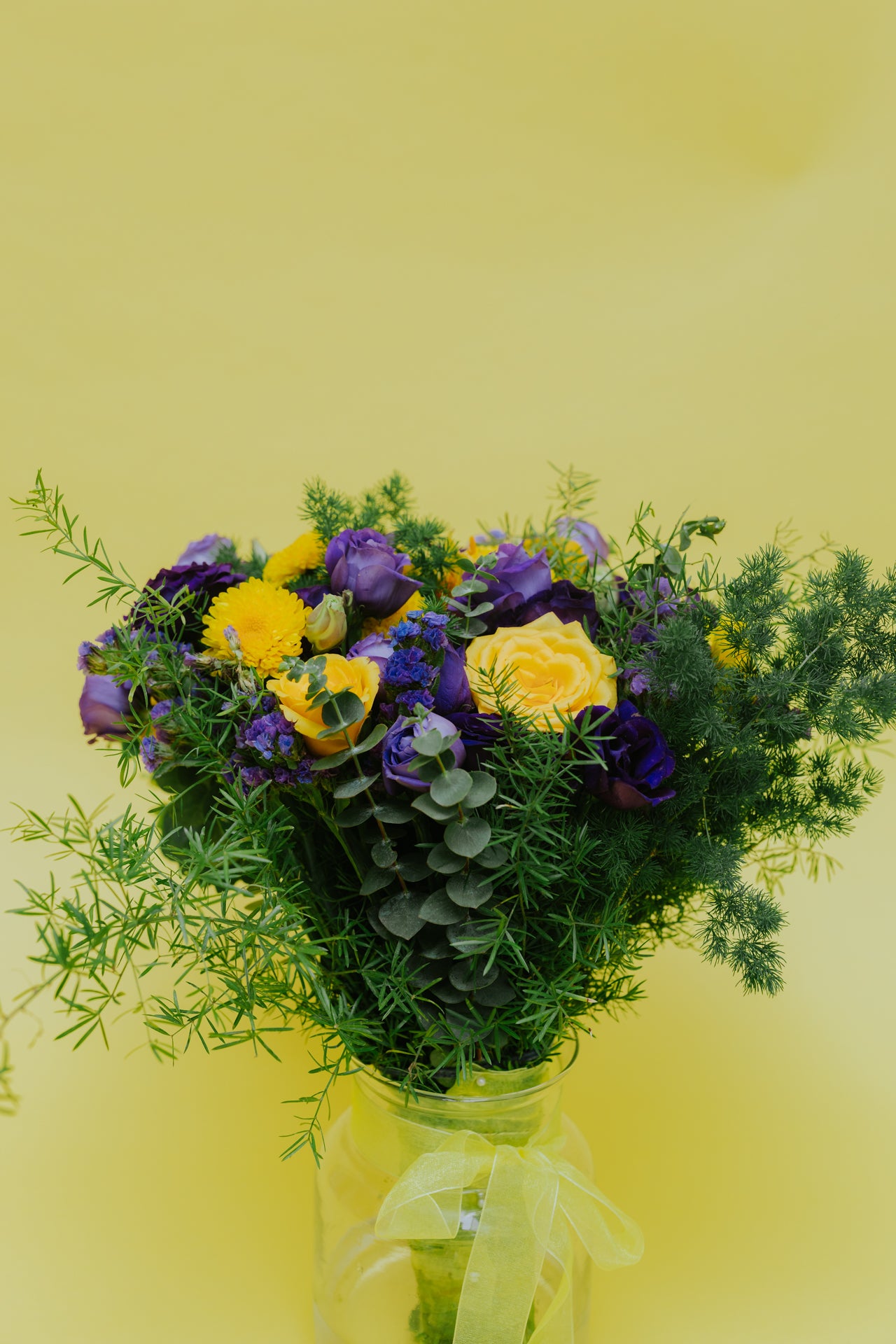 Radiant Sunset: Yellow Flowers & Purple Eustoma Bouquet